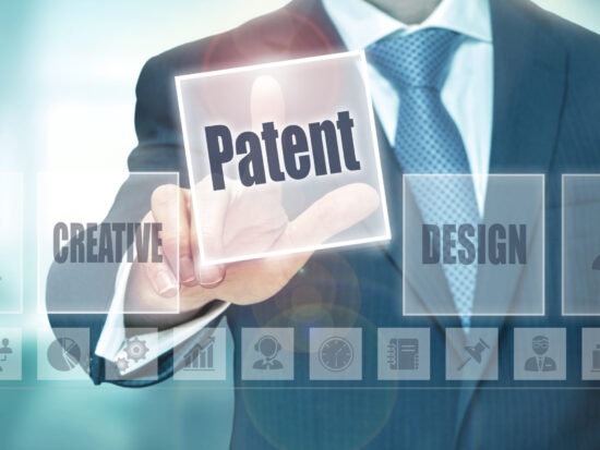 A businessman selecting a Patent Concept button