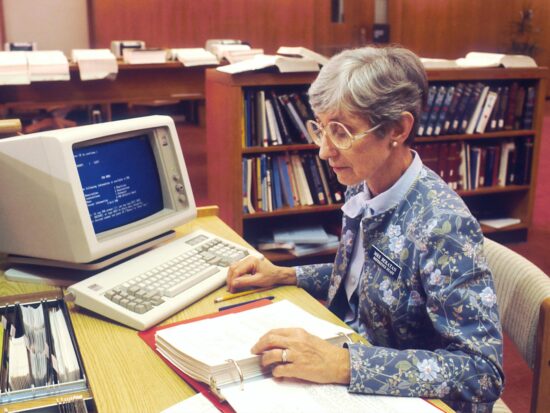 A librarian at the National Library of Medicine (NLM) is using an IBM computer to access PDQ. The Physicians Data Query was designed by the National Cancer Institute to help physicians obtain information about the most up-to-date protocols, physicians, and clinics treating cancer patients. 1987