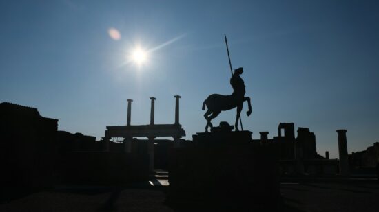 Silhouette of the centaur statue by Igor Mitoraj in the Forum at the ruins of Pompeii