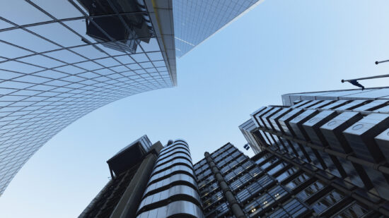 Directly below view of London city skyscrapers at dusk