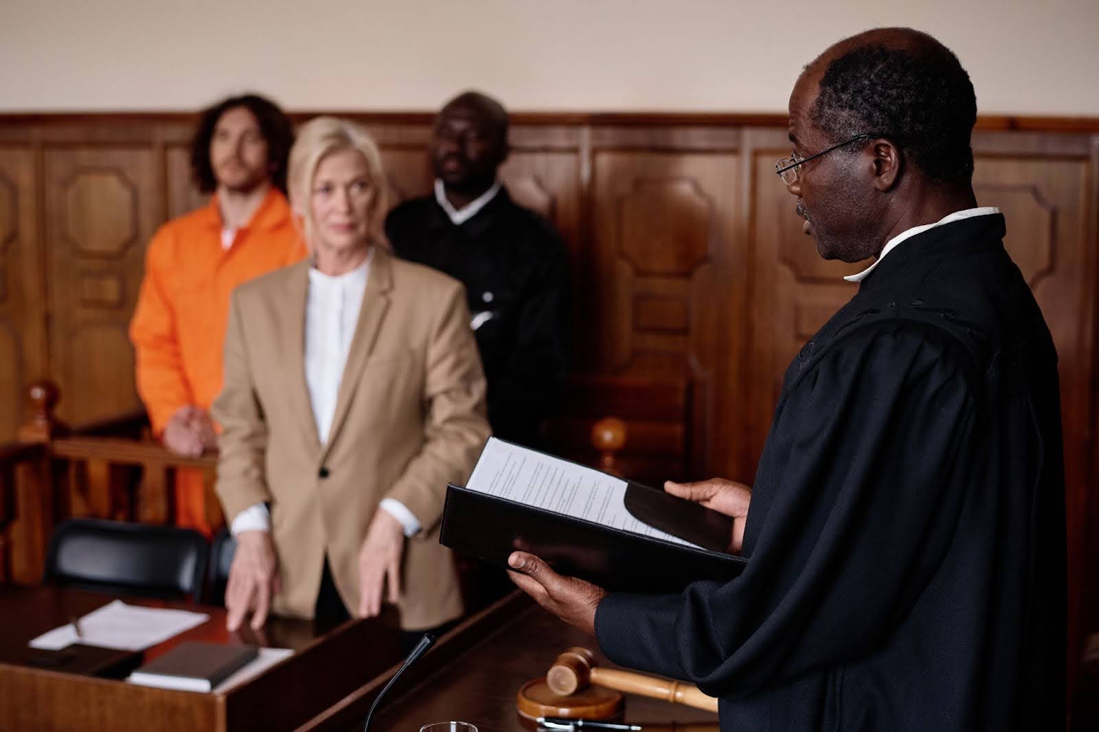 A judge in a courtroom presiding over a case that involves an employer who did not understand the new federal employment laws in 2026 and how that impacted their compliance.