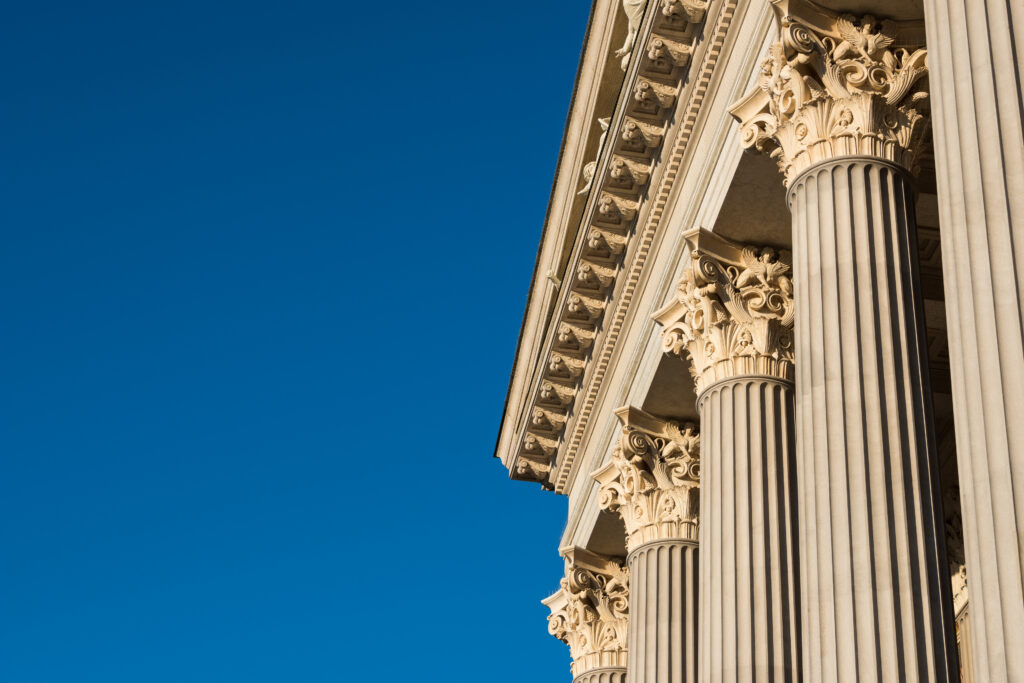 public trust in state courts; Architectural detail of marble Corinthian order columns with copy space